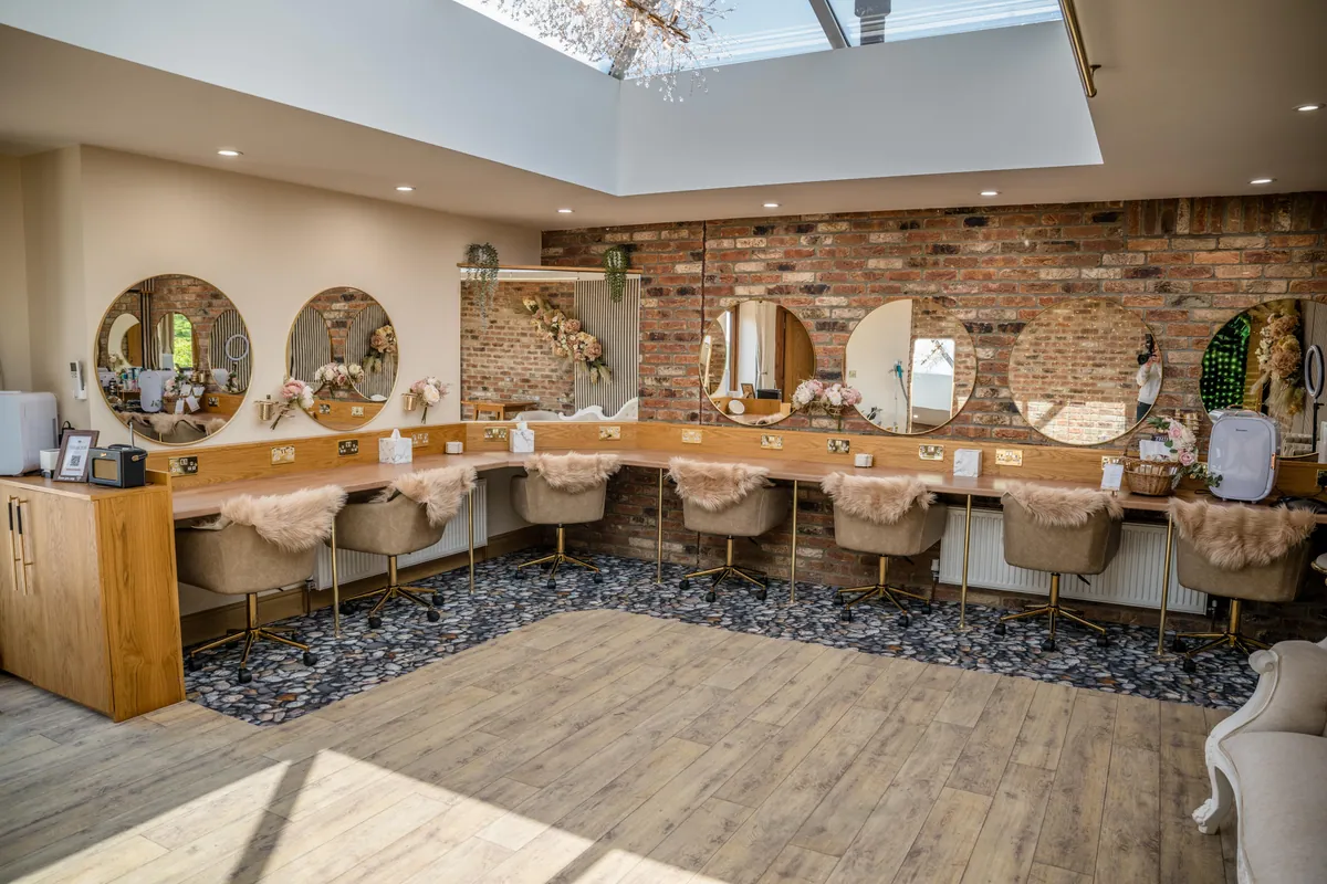 Seven vanity stations in Bess's Bridle Suite makeup room