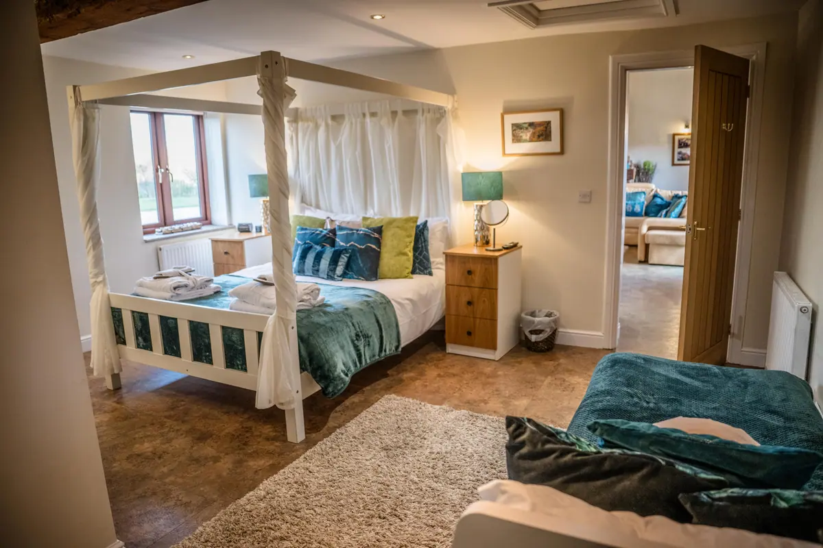 A four-poster bed prepared for guests at Thief Hall